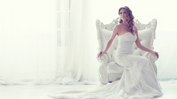 brunette_girl_model_with_white_dress_is_sitting_on_white_sofa_in_white_background_hd_model